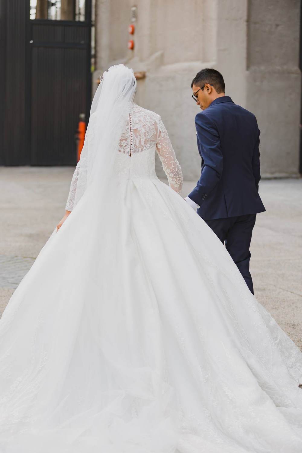 Bride and groom, bride wearing a full skirted Saarahjasmin Couture gown