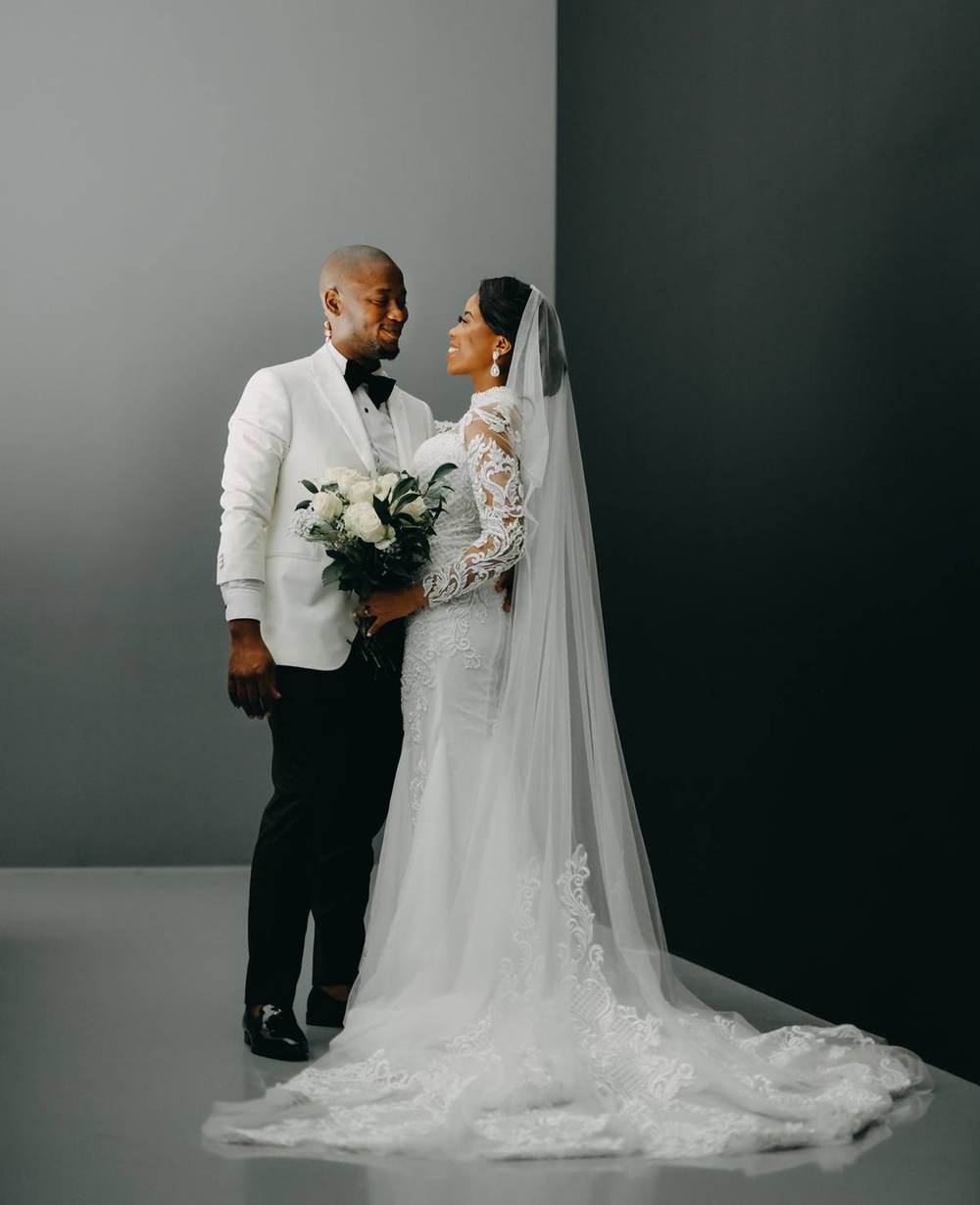 Modest bridal gown with long sleeves, high neckline and elegant train